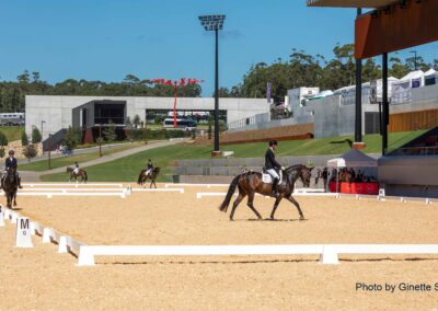 image taken from the new show jumping arena at Willinga Park. Horses are being ridden in the foreground and new GM Poles sports lighting tower standing tall in the background.